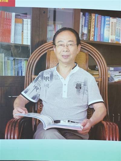 梁志刚（新昌城关中学校长兼党总支书记）